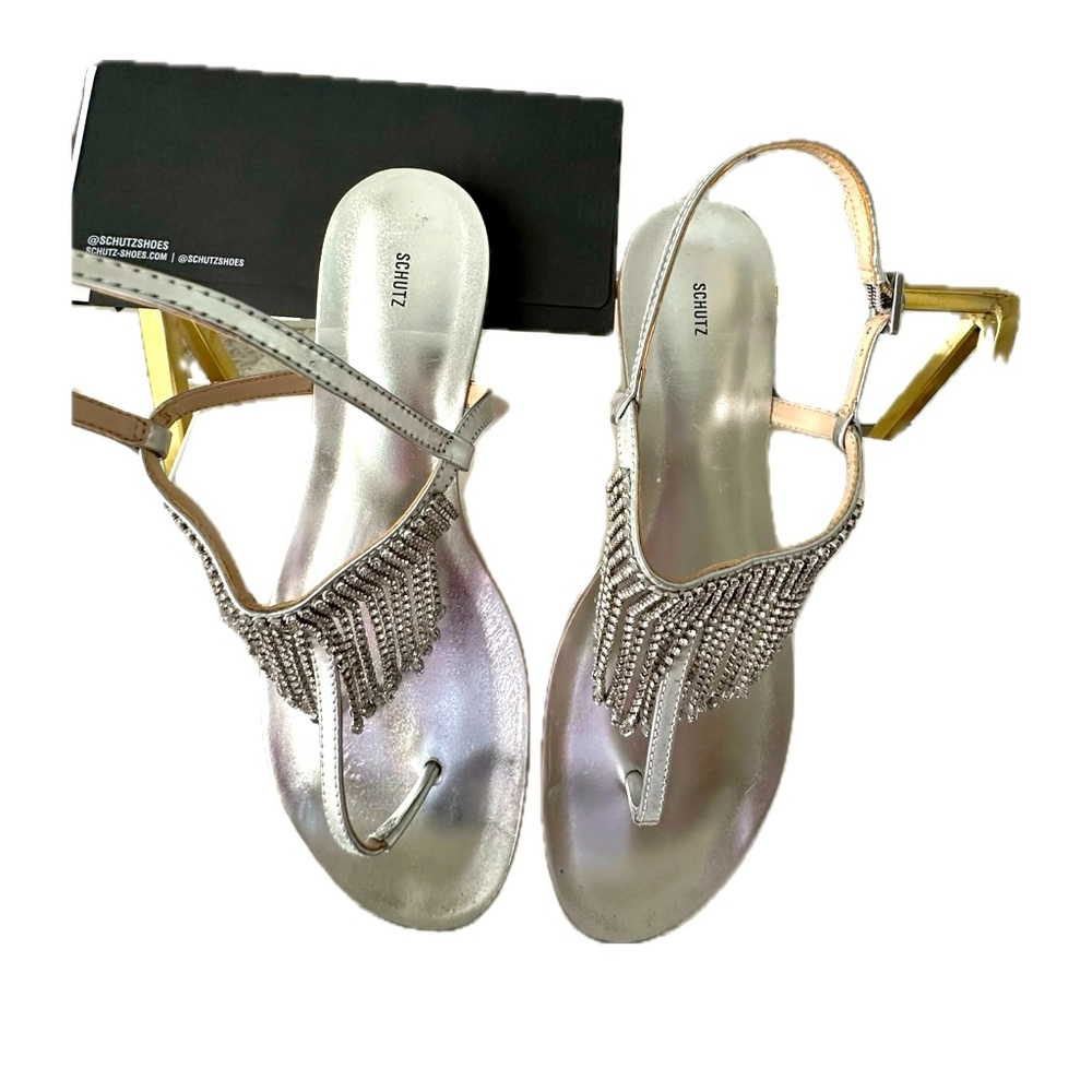 SCHUTZ in leather/rhinestones. Brand new. Never used. I don’t accept returns.
